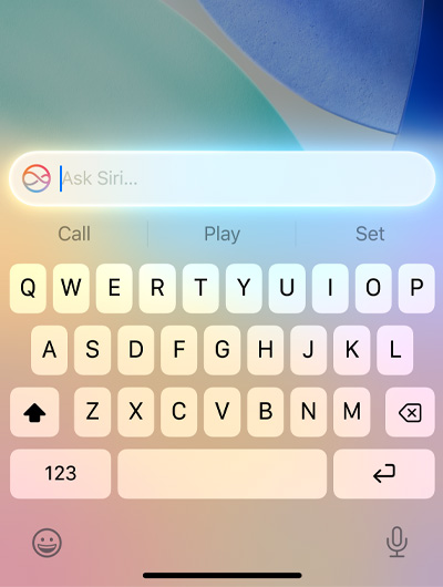 A text field at the top of keyboard in iPhone says Ask Siri