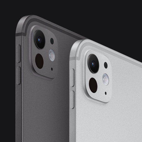 Two iPad Pro devices, back and side exterior, portrait orientation, space black color and silver color, volume-up button, volume-down button, pro camera system
