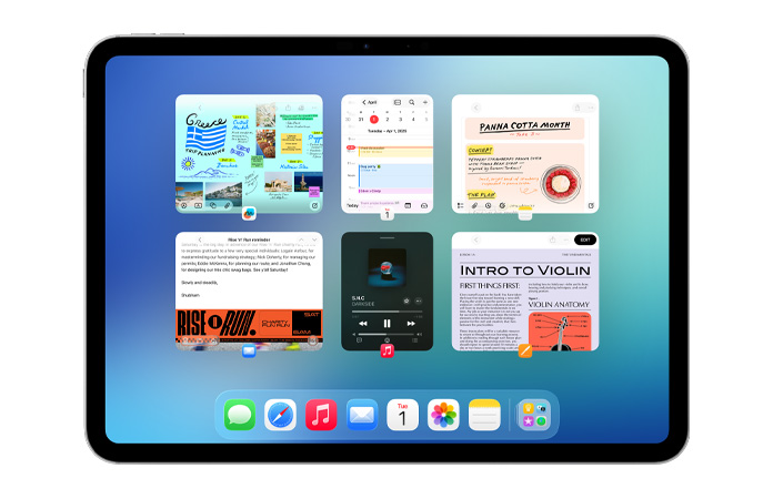 iPad, colocado na horizontal, com o ecrã a mostrar seis janelas abertas em duas filas, incluindo as apps Calendário, Notas, Apple Music e Safari
